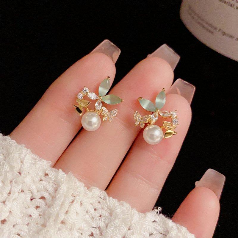 Japanese and Korean small fresh breeze zircon butterfly pearl earrings, niche luxury s925 silver stud post anti allergy female earrings and earrings