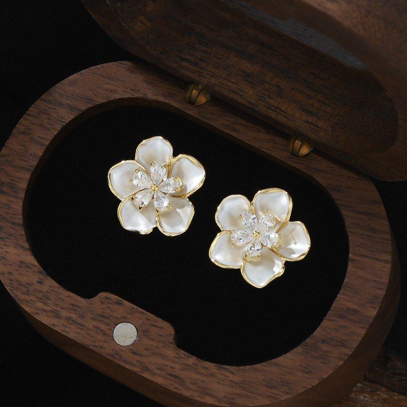 S925 Silver stud post Camellia Earrings, a new popular design with a sense of niche, light luxury, and atmospheric design. Women's anti allergic earrings