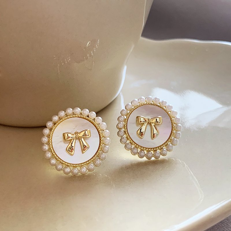 Butterfly knot pearl earrings for women, luxurious and high-end earrings, 2024 new popular pure silver stud post, niche and unique earrings