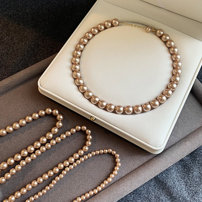 Champagne colored pearl necklace for women, light luxury, high-end feeling, collarbone chain, 2024 new popular necklace, niche neck accessory