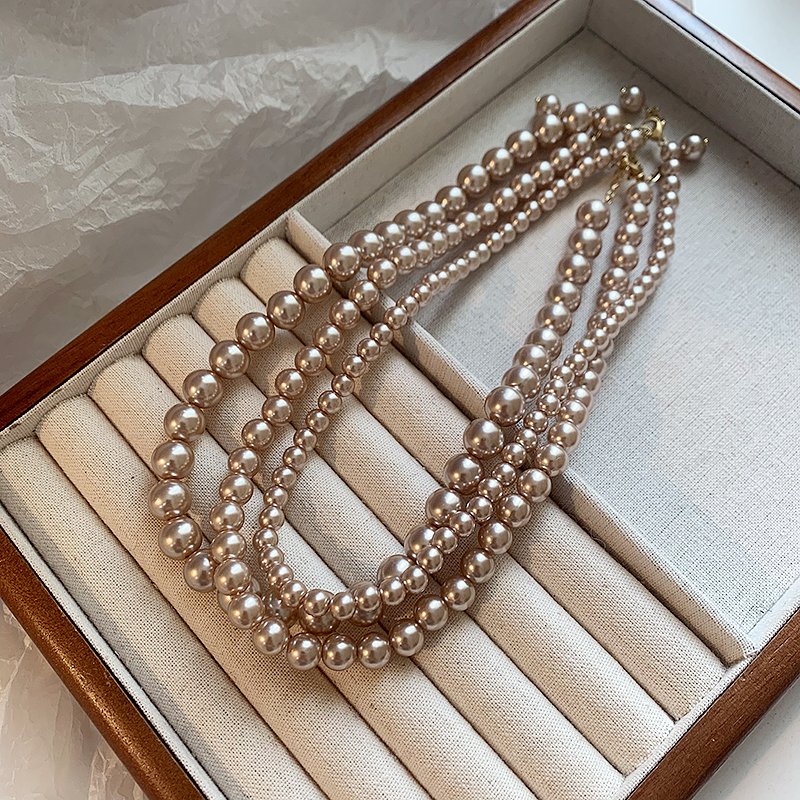 Champagne colored pearl necklace for women, light luxury, high-end feeling, collarbone chain, 2024 new popular necklace, niche neck accessory