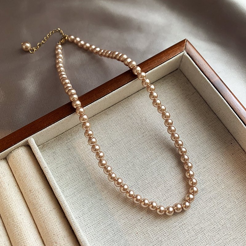 Champagne colored pearl necklace for women, light luxury, high-end feeling, collarbone chain, 2024 new popular necklace, niche neck accessory