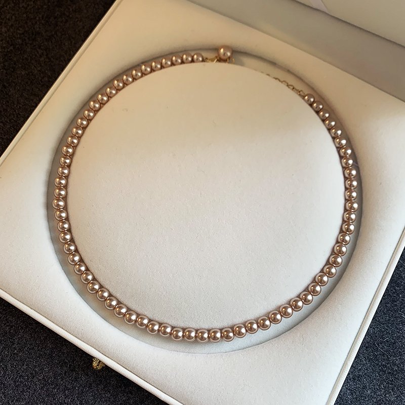 Champagne colored pearl necklace for women, light luxury, high-end feeling, collarbone chain, 2024 new popular necklace, niche neck accessory