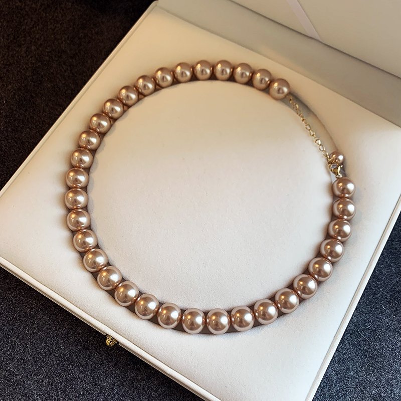 Champagne colored pearl necklace for women, light luxury, high-end feeling, collarbone chain, 2024 new popular necklace, niche neck accessory