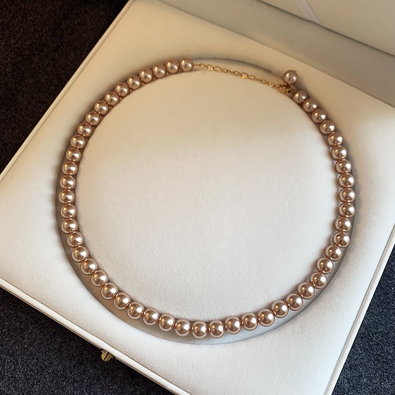 Champagne colored pearl necklace for women, light luxury, high-end feeling, collarbone chain, 2024 new popular necklace, niche neck accessory