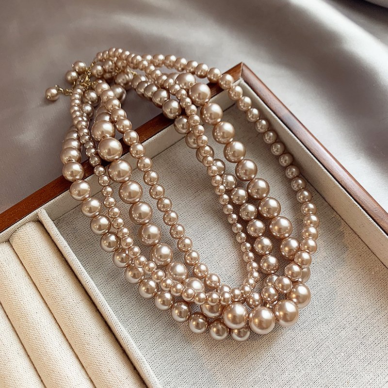 Champagne colored pearl necklace for women, light luxury, high-end feeling, collarbone chain, 2024 new popular necklace, niche neck accessory