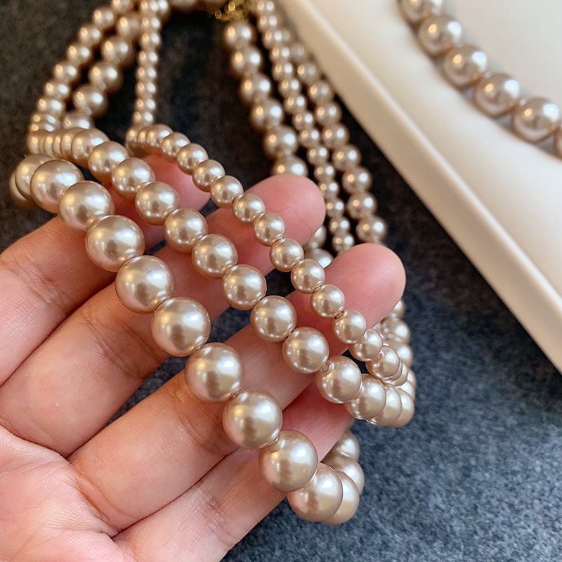 Champagne colored pearl necklace for women, light luxury, high-end feeling, collarbone chain, 2024 new popular necklace, niche neck accessory