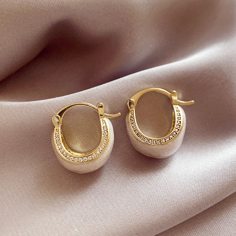 White glazed zirconium inlaid earrings for women, with a light luxury and high-end temperament. 2024 new popular and unique earring earrings