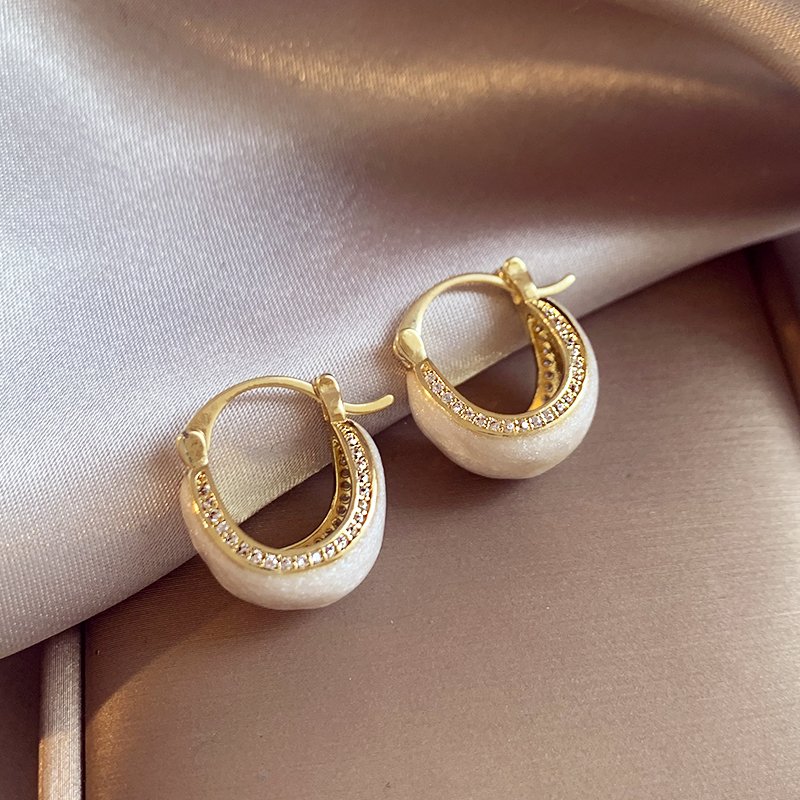 White glazed zirconium inlaid earrings for women, with a light luxury and high-end temperament. 2024 new popular and unique earring earrings