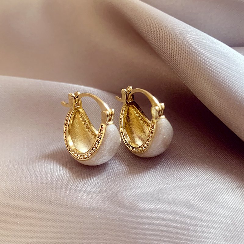 White glazed zirconium inlaid earrings for women, with a light luxury and high-end temperament. 2024 new popular and unique earring earrings