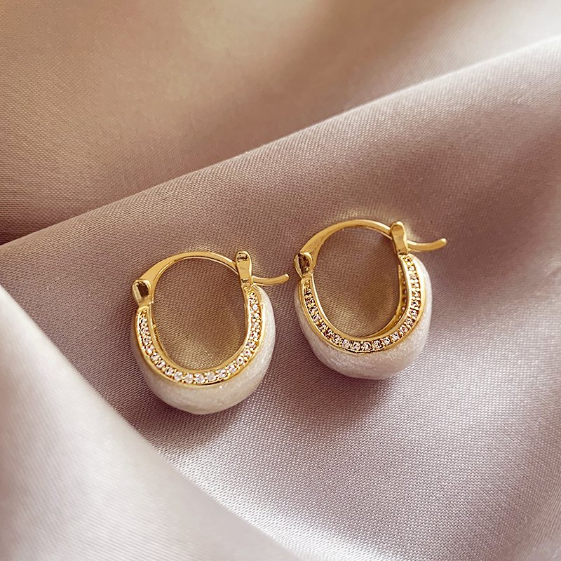 White glazed zirconium inlaid earrings for women, with a light luxury and high-end temperament. 2024 new popular and unique earring earrings