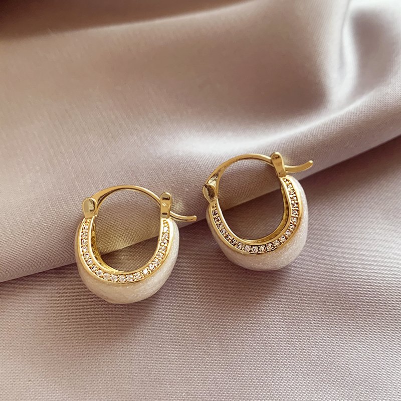 White glazed zirconium inlaid earrings for women, with a light luxury and high-end temperament. 2024 new popular and unique earring earrings