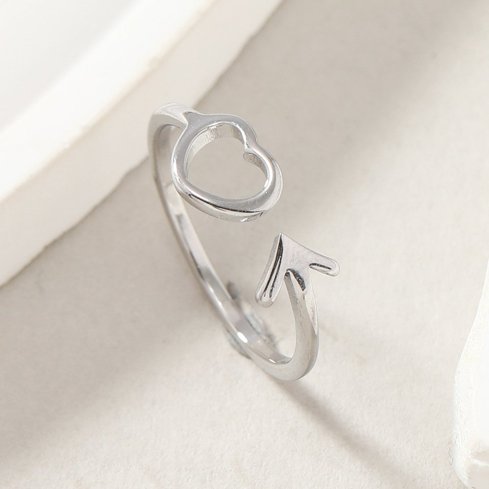 European and American titanium steel ring with niche design, cut hollow heart arrow opening adjustable stainless steel jewelry