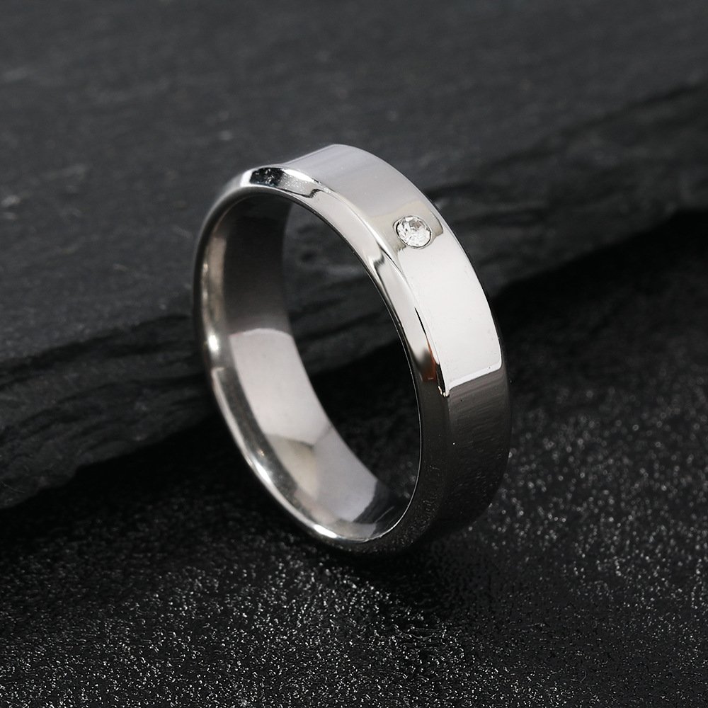 Stainless steel jewelry, simple and fashionable, with two beveled edges and a shiny surface set with a diamond, a couple titanium steel ring