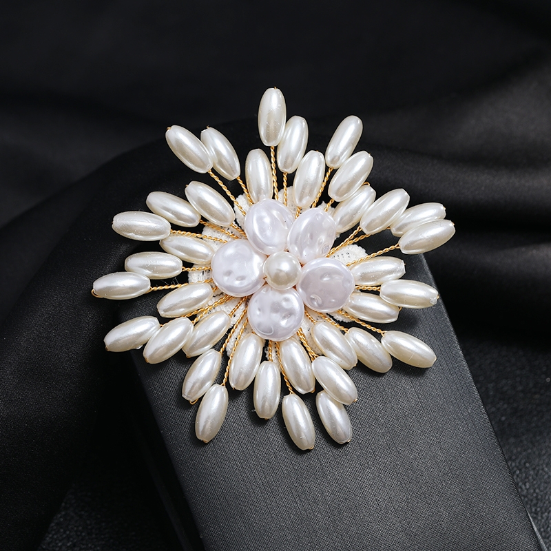 White, elegant, luxurious pearl brooch, chest flower