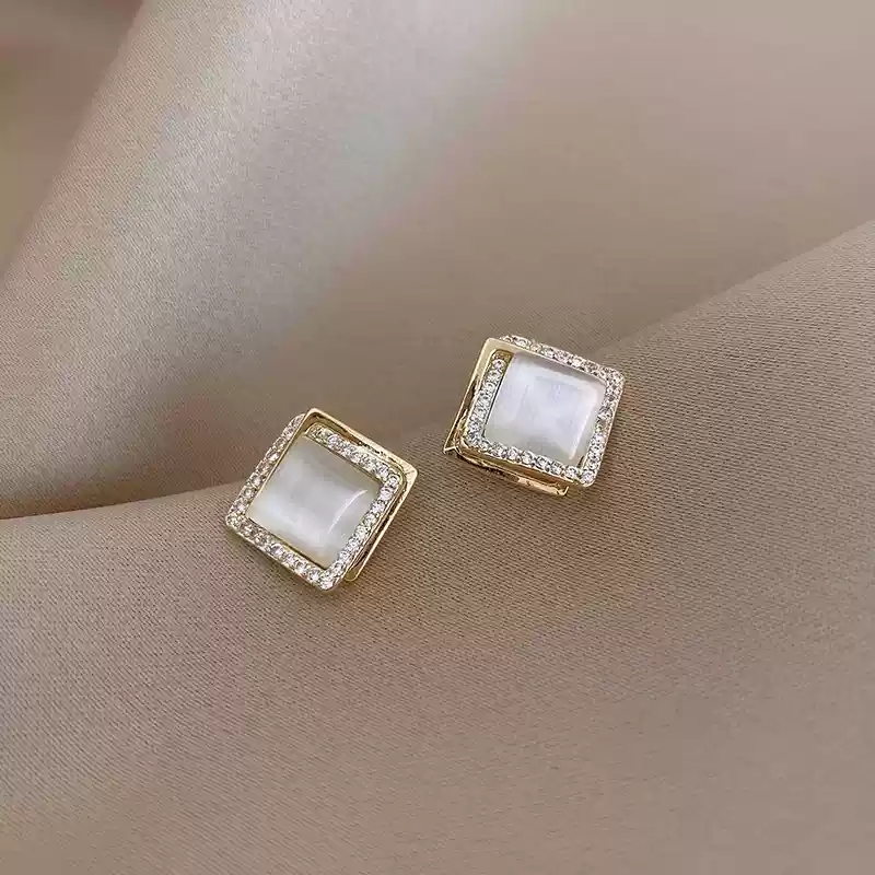 Diamond studded earrings with diamond shapes