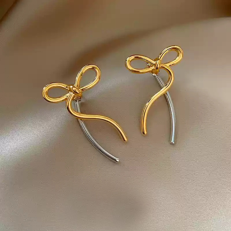 Gold and silver contrasting bow earrings~