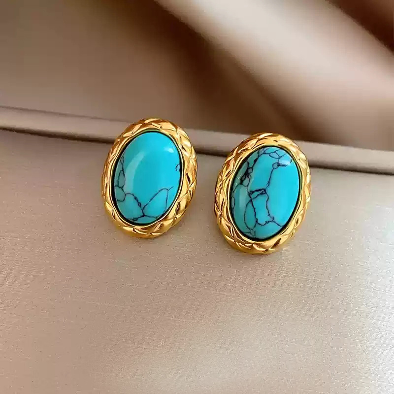 A pair of oval natural turquoise earrings and 925 silver stud posts