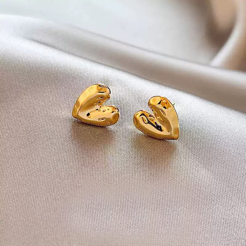 Golden textured heart-shaped earrings