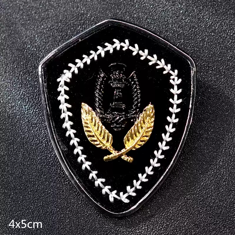 4-Shield shaped badge